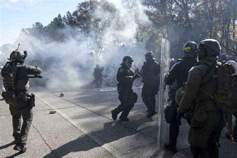 Police and protesters clash at Atlanta training center site derided by opponents as ‘Cop City’
